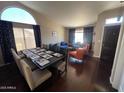 Spacious living room featuring hardwood floors and a combined dining area at 4016 E Western Star Blvd, Phoenix, AZ 85044
