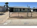 Charming single-story home with a fenced yard and covered parking at 4410 N 50Th Dr, Phoenix, AZ 85031