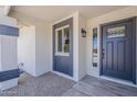 View of the beautiful front door and desert-style landscaping of this home at 4509 E La Puente Ave, Phoenix, AZ 85044