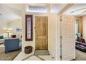 Warm and welcoming entryway featuring neutral tones and access to multiple living spaces at 6350 S Four Peaks Pl, Chandler, AZ 85249
