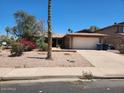 Charming single-story home with desert landscaping and a two-car garage at 7311 S Mcallister Ave, Tempe, AZ 85283