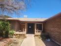 Inviting front entrance with brick facade and desert landscaping at 7311 S Mcallister Ave, Tempe, AZ 85283