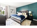 Beautifully appointed main bedroom featuring a panel accent wall and elegant furnishings at 7350 N Via Paseo Del Sur -- # P105, Scottsdale, AZ 85258