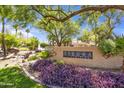 Well-manicured community signage surrounded by beautiful foliage, creating an inviting entrance at 7575 E Indian Bend Rd # 1137, Scottsdale, AZ 85250