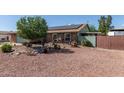 Charming single-story home featuring a well-maintained front yard, lush landscaping, and a welcoming exterior at 7608 W Mescal St, Peoria, AZ 85345
