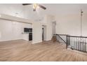 Open living space with stairs and black railing, ceiling fan, and natural light at 917 N Blackbird Dr, Gilbert, AZ 85234