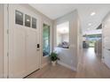 Bright foyer welcomes with natural light and a view into the dining and kitchen areas at 9750 E Radioactive Dr, Mesa, AZ 85212