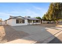 Inviting single-story home with a spacious driveway, manicured landscaping, and charming curb appeal at 13624 N 31St Ave, Phoenix, AZ 85029