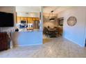 Open-concept kitchen and dining area with modern appliances and comfortable seating at 14950 W Mountain View Blvd # 2210, Surprise, AZ 85374
