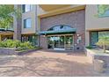 Building entrance features automated sliding doors and brick facade at 16 W Encanto Blvd # 305, Phoenix, AZ 85003
