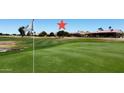 Scenic golf course view showing meticulously maintained greens at 17406 N Escalante Ln, Surprise, AZ 85374