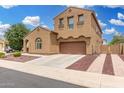 Charming two-story home with an attached two-car garage and low maintenance yard at 1876 E Azalea Ct, Gilbert, AZ 85298