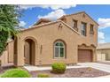 Charming two-story home with a two-car garage and arched front entry at 1876 E Azalea Ct, Gilbert, AZ 85298