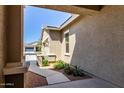 Inviting entrance featuring a paved walkway and desert-style landscaping at 21031 E Poco Calle St, Queen Creek, AZ 85142