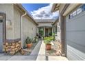 Inviting courtyard with well-maintained landscaping and a walkway to the front door at 21711 E Arroyo Verde Dr, Queen Creek, AZ 85142
