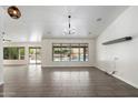Bright living room with tile floors, modern lighting and a great view of the backyard at 26264 N 46Th St, Phoenix, AZ 85050