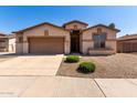 Inviting home featuring a well-maintained front yard, neutral paint scheme, and convenient two-car garage at 2732 E Tyson St, Chandler, AZ 85225