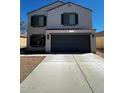 Charming two-story home with a driveway leading to an attached garage at 37061 W Bello Ln, Maricopa, AZ 85138