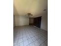 Living room with tile flooring, ceiling fan, and access to the rest of the home at 4231 N 69Th Dr # 1297, Phoenix, AZ 85033