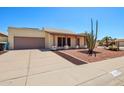 This home has a two-car garage, desert landscaping, and is conveniently located on a paved street at 4231 W Villa Maria Dr, Glendale, AZ 85308