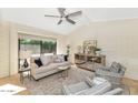 Inviting living room with a large window, vaulted ceilings, and comfortable seating creating a relaxing atmosphere at 4525 N 66Th St # 10, Scottsdale, AZ 85251