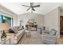 Bright living room featuring vaulted ceilings, neutral decor, and large windows providing natural light at 4525 N 66Th St # 10, Scottsdale, AZ 85251