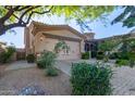Inviting home exterior features a two-car garage and manicured landscaping for great curb appeal at 6202 E Mckellips Rd # 25, Mesa, AZ 85215