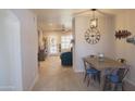 Inviting dining area with a rustic wooden table and views into the living room at 6885 E Cochise Rd # 127, Paradise Valley, AZ 85253