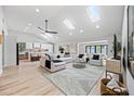 Bright living room featuring skylights, modern furnishings, and an open-concept design at 8544 E Heatherbrae Dr, Scottsdale, AZ 85251