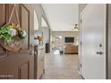 Bright and airy entryway with tile floors, a cozy living room, and neutral wall colors at 894 S Buena Vista Dr, Apache Junction, AZ 85120