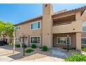 Inviting condo exterior with landscaped front, sidewalk entrance, and architectural column detail at 9450 E Becker Ln # 1071, Scottsdale, AZ 85260