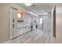 Spacious kitchen featuring sleek white cabinets, stainless steel appliances, and modern finishes at 9551 E Redfield Rd # 1061, Scottsdale, AZ 85260