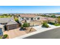 Charming two-story home featuring a tile roof, three-car garage, and desert landscaping at 9677 W Patrick Ln, Peoria, AZ 85383
