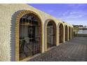Charming home featuring arched entryways with wrought iron gates and brick accents at 1249 E Desert Park Ln, Phoenix, AZ 85020