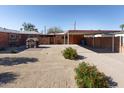 Large backyard includes a carport, playhouse, and low-maintenance landscaping at 1330 E Monte Vista Rd, Phoenix, AZ 85006