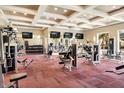 Spacious fitness center with modern exercise equipment and multiple wall mounted televisions at 1367 S Country Club Dr # 1127, Mesa, AZ 85210