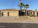Lovely single-story home featuring desert landscaping and a large three-car garage at 15801 W Goldenrod Dr, Surprise, AZ 85374