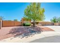 Attractive single-story home enhanced by mature landscaping, a rock lawn, and a large, shady tree at 16425 N 46Th Dr, Glendale, AZ 85306