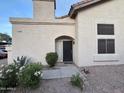 Inviting home featuring a stucco exterior, desert landscaping, and a cozy front porch at 2019 W Lemon Tree Pl # 1124, Chandler, AZ 85224