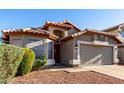 Charming single-story home with a well-manicured front yard and a spacious two-car garage at 2223 E Crest Ln, Phoenix, AZ 85024