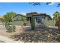 Landscaped front yard featuring desert plants, and a well-maintained exterior at 30031 N Little Leaf Dr, San Tan Valley, AZ 85143