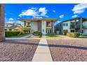 Charming two-story house with modern architecture, complemented by lush green lawn at 306 W Culver St, Phoenix, AZ 85003