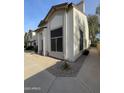 Charming townhome boasting a neutral color palette, a welcoming entrance, and well-maintained landscaping at 4114 E Union Hills Dr # 1008, Phoenix, AZ 85050