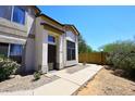 Inviting home exterior featuring desert landscaping, a walkway, and a secure front entrance at 4114 E Union Hills Dr # 1088, Phoenix, AZ 85050
