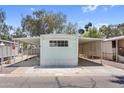 Inviting single-story home with covered parking and attractive gravel landscaping at 535 S Alma School Rd # 17, Mesa, AZ 85210
