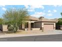 Attractive single-story home with desert landscaping and a two-car garage at 6103 S 54Th Ave, Laveen, AZ 85339