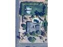 Aerial shot showcasing the property's pool, mature landscaping, and proximity to N 64th St at 6408 E Gary Rd, Scottsdale, AZ 85254