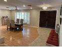 Open dining area with seating for six, lovely light fixture, and decorative shutters at 6408 E Gary Rd, Scottsdale, AZ 85254