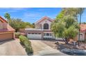 Charming two-story home with a well-maintained yard, attractive landscaping, and a spacious two-car garage at 1130 S Surfside Dr, Gilbert, AZ 85233