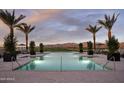 A luxurious pool featuring mountain views with lounge seating, offering a serene escape in a picturesque setting at 11300 N Casa Dega Dr # 1090, Surprise, AZ 85388